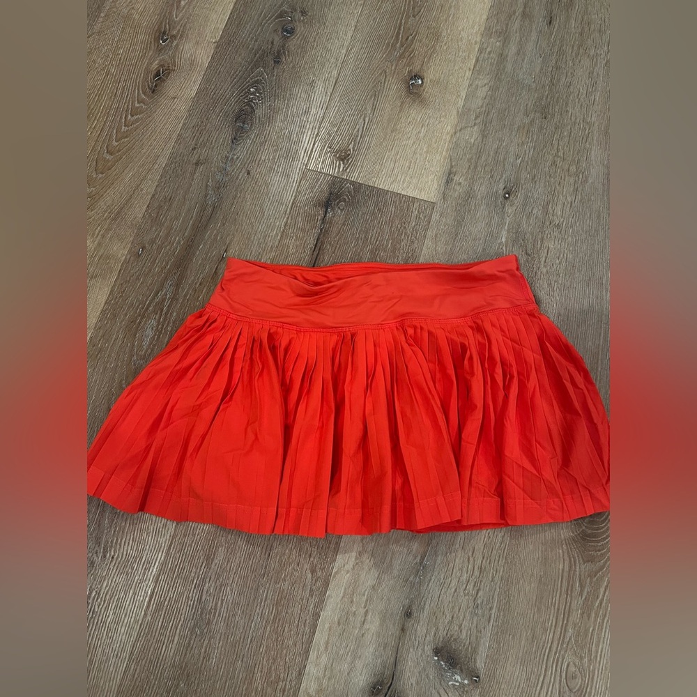 Coral pleated LuluLemon tennis shirt